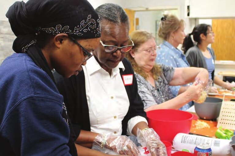 Northside Neighborhood House staff preparing food together